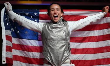 Lee Kiefer celebrates winning a gold medal in women's individual foil