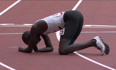 Chiengjiek of Refugee Olympic Team falls during 800m prelim