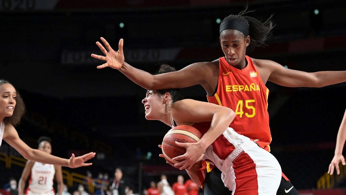 Spain takes down Canada to stay unbeaten in group stage
