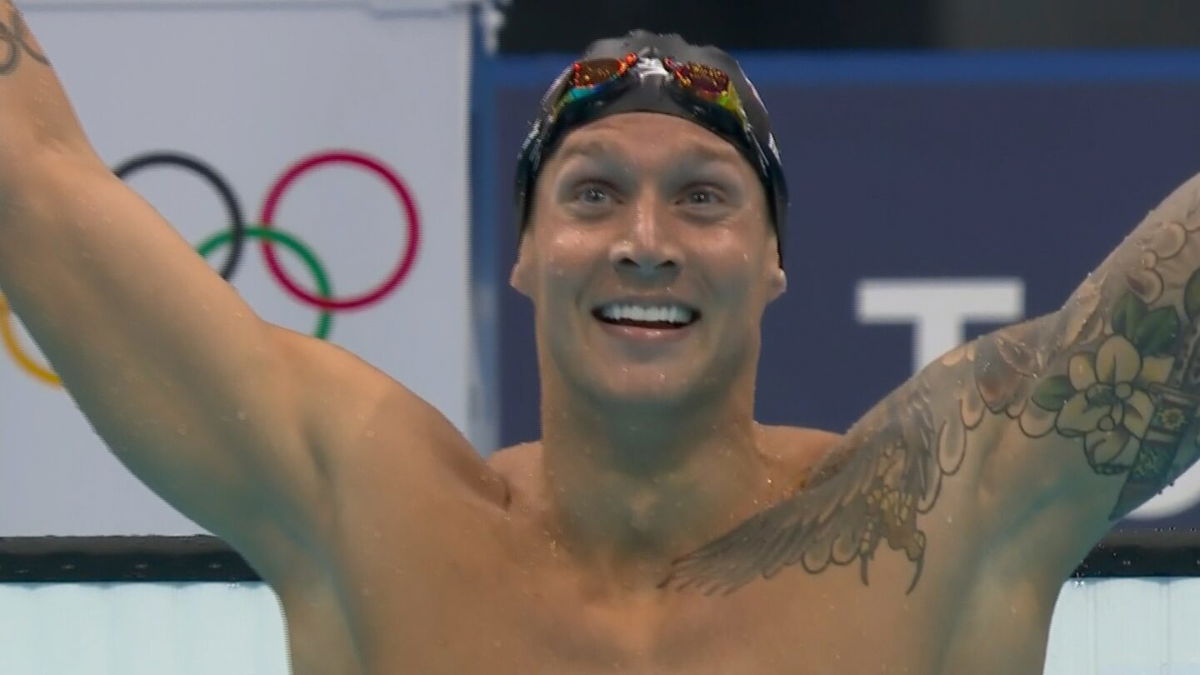 Caeleb Dressel celebrates after winning gold