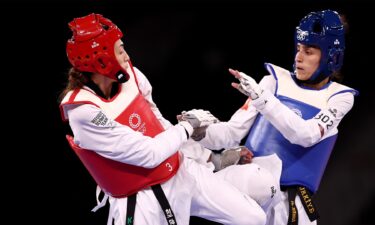 Lo Chia-Ling and Tekiath Ben Yessouf kick towards each other mid-competition