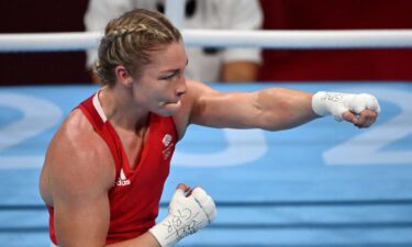 Lauren Price celebrates with punches