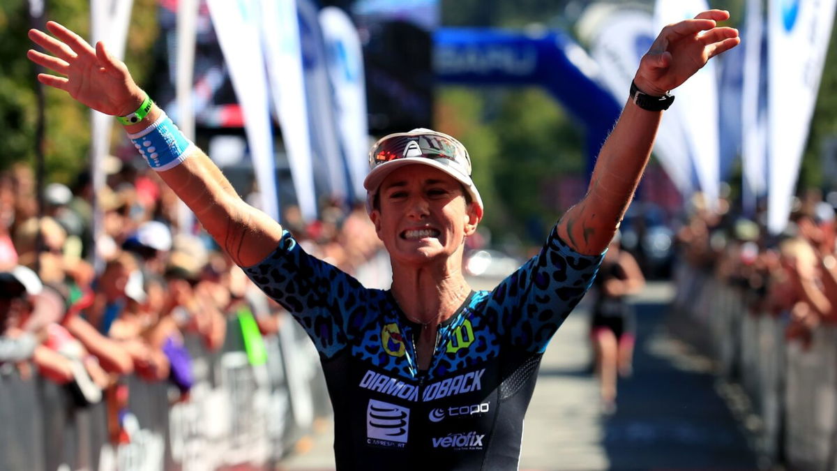 Rach McBride of Canada celebrates a third place finish in the Pro Women's Division during the Subaru Ironman Canada triathlon on July 30