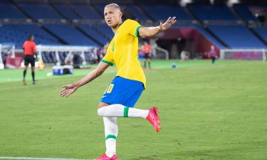 Richarlison of Brazil celebrates after scoring his team's second goal in the Men's First Round Group D match between Brazil and Germany.