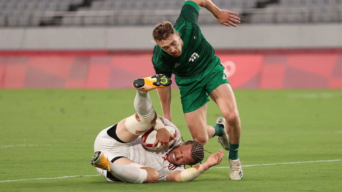 Stephen Tomasin grimaces as he scores against Ireland