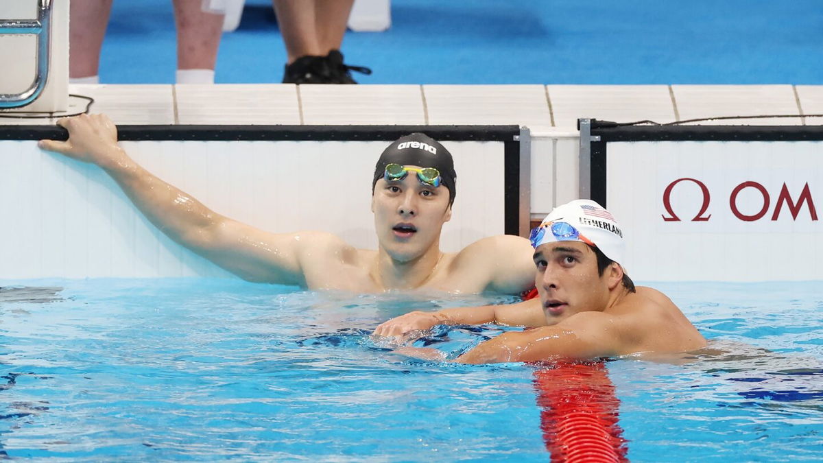 Seto Daiya (left) looks on in disbelief after missing the final of the men's 400m IM. American Jay Litherland (right) successfully advanced.