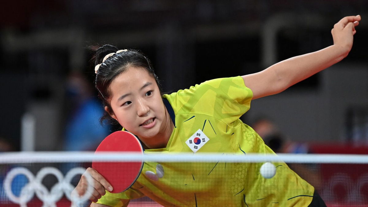 Korea's Shin in action against Luxembourg's Ni in the second round of women's singles.