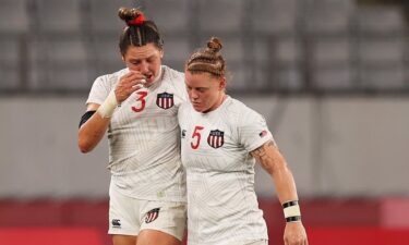 Abby Gustaitis and Alev Kelter of the United States react to a quarterfinal loss to Great Britain.