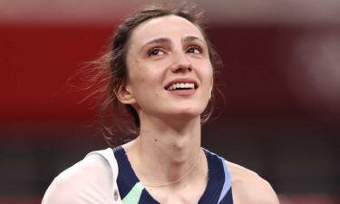 Maria Lasitskene celebrates her gold medal win in the high jump final at the 2020 Tokyo Olympic Games