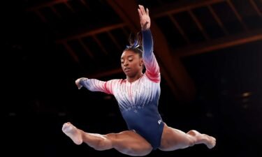 Simone Biles competes in the women's balance beam final at the 2020 Tokyo Olympic Games.