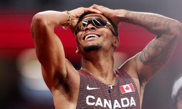 Andre De Grasse of Team Canada celebrates after winning the gold medal in the Men's 200m Final on day twelve of the Tokyo 2020 Olympic Games