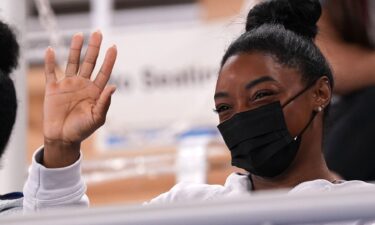 Simone Biles waves