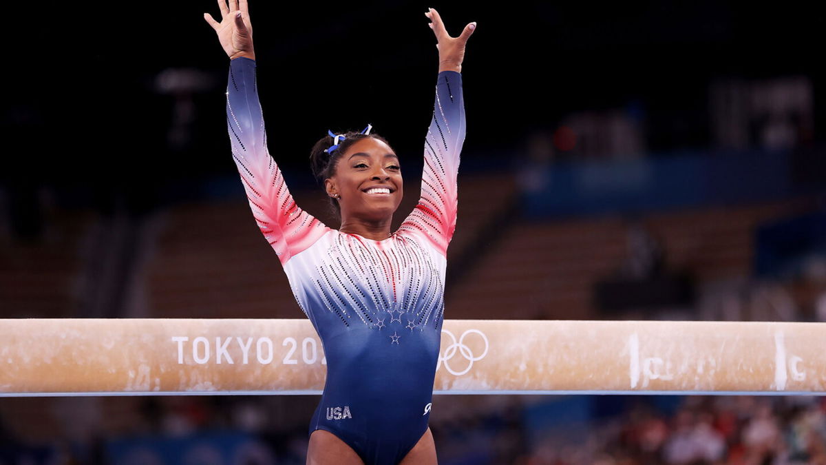 Simone Biles competes on beam