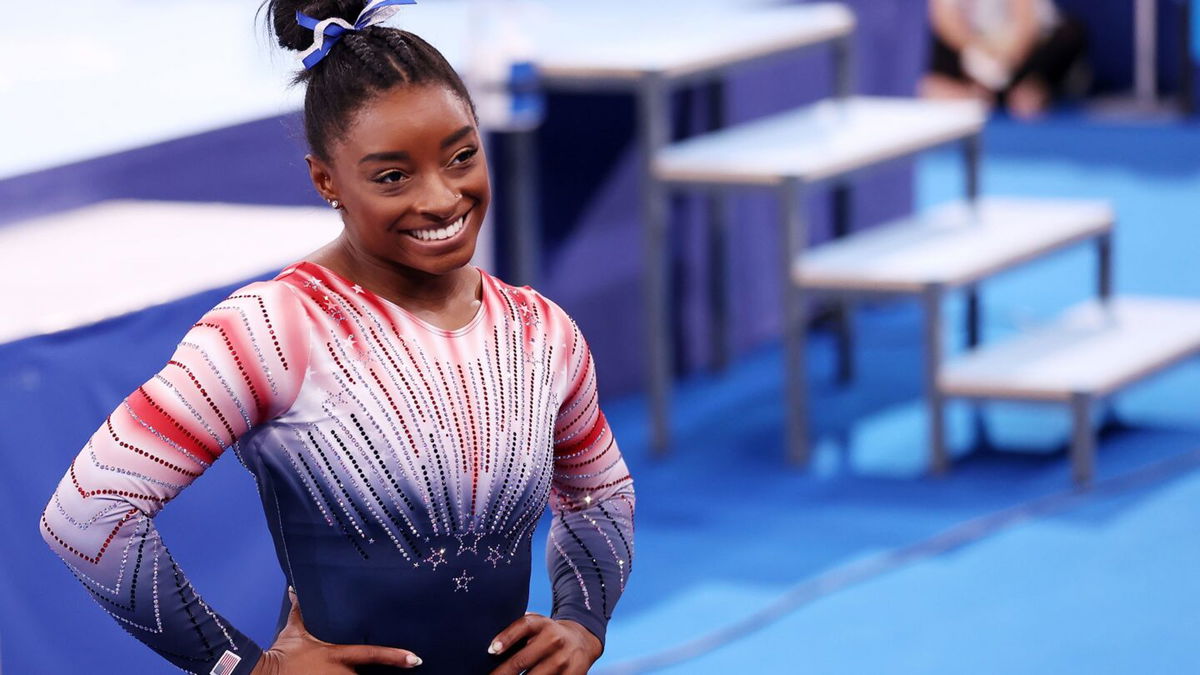 Simone Biles competes on beam