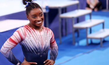 Simone Biles competes on beam