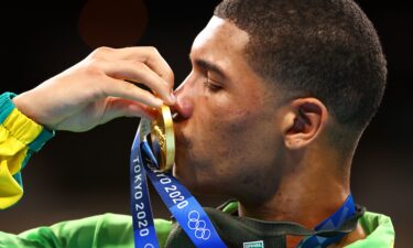 Herbert Sousa of Team Brazil poses for a photo with his gold medal after winning the men's middleweight class.