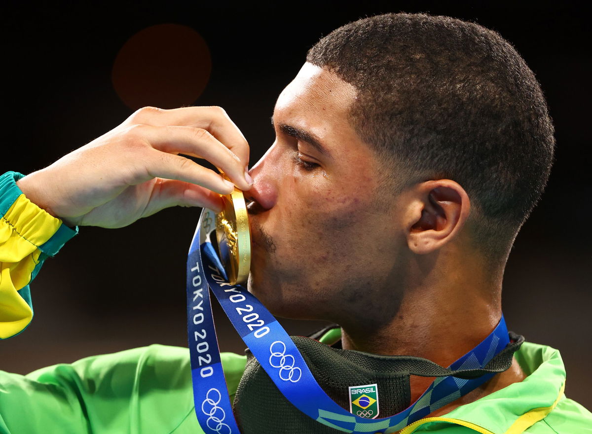 Herbert Sousa of Team Brazil poses for a photo with his gold medal after winning the men's middleweight class.