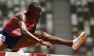 USA's Grant Holloway competes in the men's 110m hurdles semi-finals during the Tokyo 2020 Olympic Games