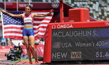 USA's Sydney Mclaughlin celebrates after winning the women's 400m hurdles final setting a new world record during the Tokyo 2020 Olympic Games