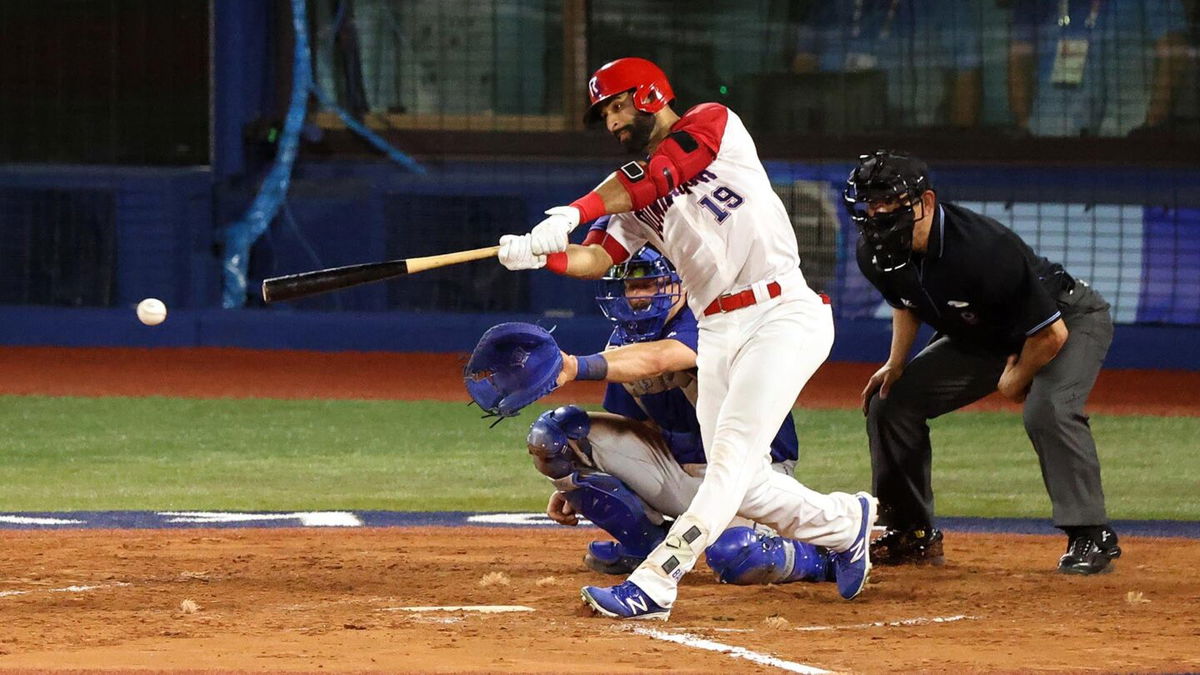 A member of the Dominican Republic baseball makes contact for a clean hit