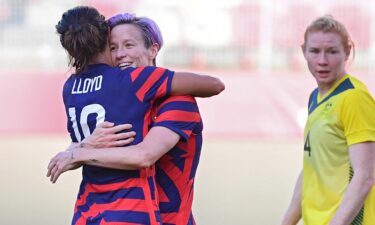 Megan Rapinoe embraces Carli Lloyd after scoring in the bronze medal match