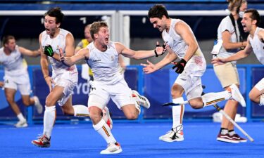 Overjoyed Belgian players celebrate victory after winning the gold medal final match over Australia