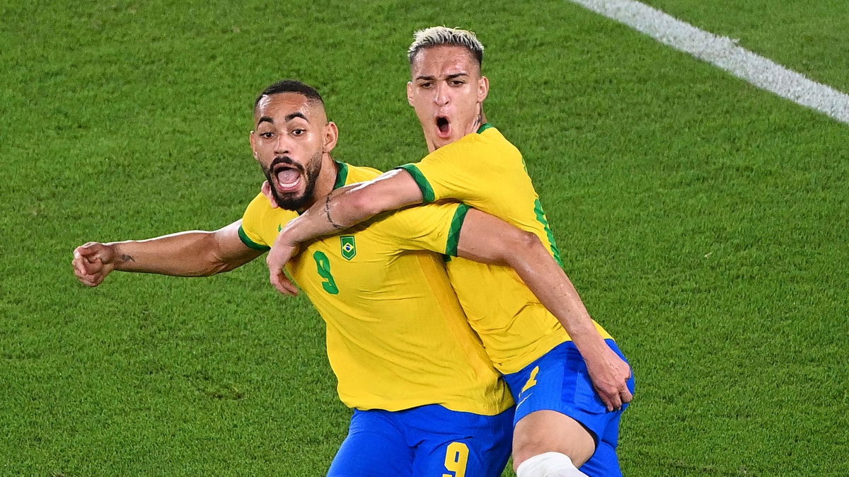 Matheus Cunha pumps his fist and celebrates with Antony after Brazil's opening goal