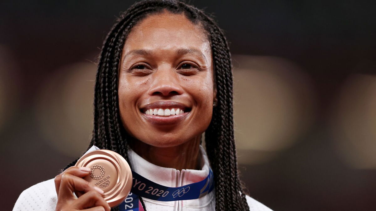 Allyson Felix holds her medal on the podium during the medal ceremony for the Women's 400m