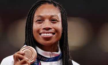 Allyson Felix holds her medal on the podium during the medal ceremony for the Women's 400m