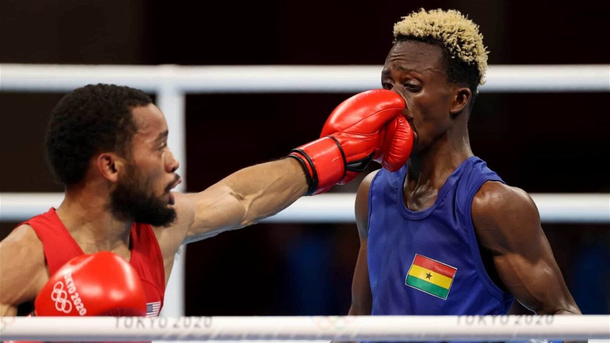 U.S. featherweight Duke Ragan (in red) beat Sam Takyi of Ghana to earn a spot in the finals at the Tokyo Olympics.