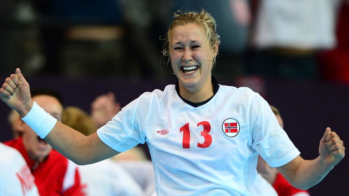 Norway veteran  Marit Malm Frafjord celebrates.