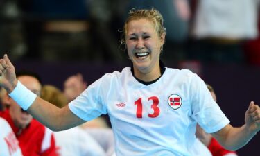 Norway veteran  Marit Malm Frafjord celebrates.