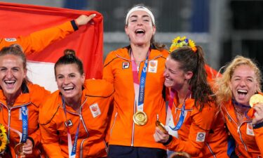 The Netherlands women's hockey team celebrate.