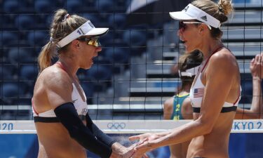 April Ross #1 and Alix Klineman #2 of Team United States celebrate while competing against Team Australia during the Women's Gold Medal Match on day fourteen of the Tokyo 2020 Olympic Games