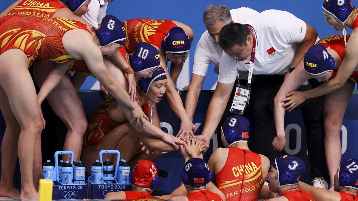 China in a water polo huddle