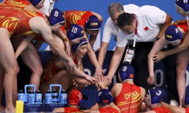 China in a water polo huddle