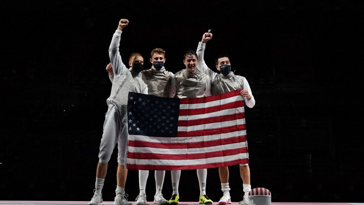 USA's foil team celebrates after winning against Japan's in the men's team foil bronze medal bout during the Tokyo 2020 Olympic Games