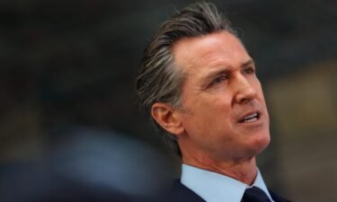 California Gov. Gavin Newsom looks on during a press conference at The Unity Council on May 10 in Oakland
