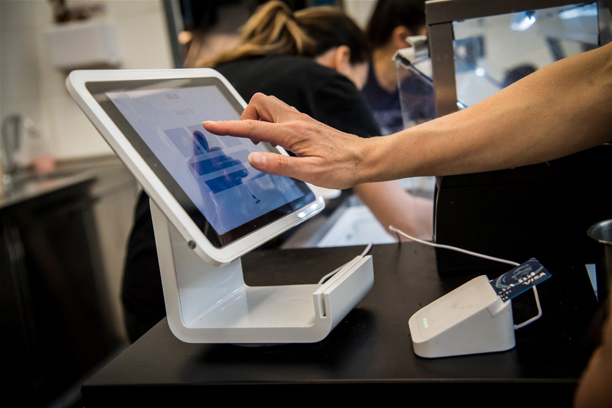 Square anounced Sunday that it's buying Afterpay for $29 billion. A customer uses a Square Inc. device to make a payment in San Francisco