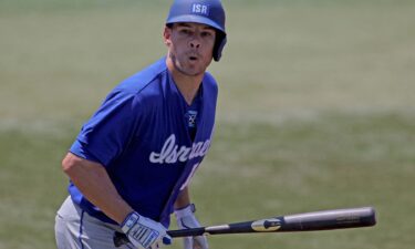 Israel's Danny Valencia hits a three run home run during the third inning of a Tokyo Olympics baseball tournament Round 1 game between Israel and Mexico at Yokohama Baseball Stadium.