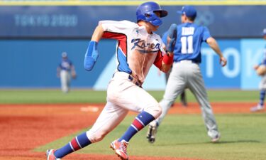 Park Hae-Min of South Korea runs home in the fifth inning against Israel during the knockout stage the Olympic baseball tournament.