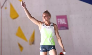 Janja Garnbret of Slovenia celebrates after getting a top during the sport climbing women's combined final on Day 14 of the Tokyo 2020 Olympic Games at Aomi Urban Sports Park