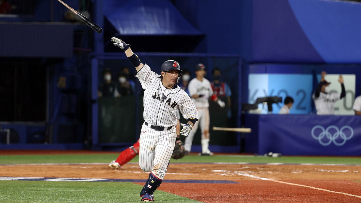 Takuya Kai of Japan reacts after hitting a game-winning single in the tenth inning to defeat  the United States 7-6 during the knockout stage of the Olympic baseball tournament.