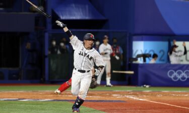 Takuya Kai of Japan reacts after hitting a game-winning single in the tenth inning to defeat  the United States 7-6 during the knockout stage of the Olympic baseball tournament.