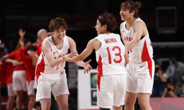 Japanese players celebrate during the women's semifinal contest against France.