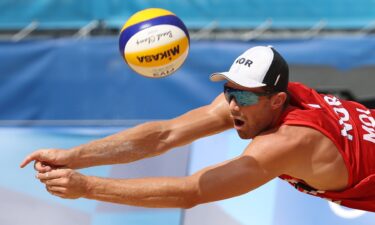 Anders Mol of Team Norway dives for the ball against Team ROC during the Men's Quarterfinal beach volleyball on day twelve of the Tokyo 2020 Olympic Games