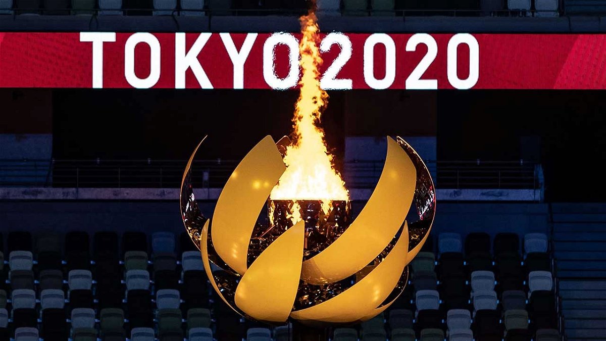 The opening ceremony's torch shines brightly in Tokyo.