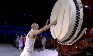 Japanese drummer strikes the drum