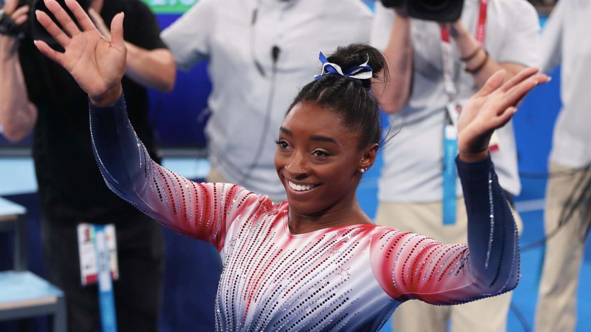 Simone Biles celebrating during her balance beam final