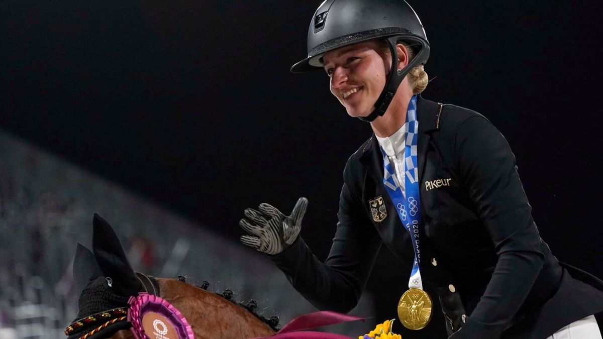 Julia Krajewski smiles on her horse